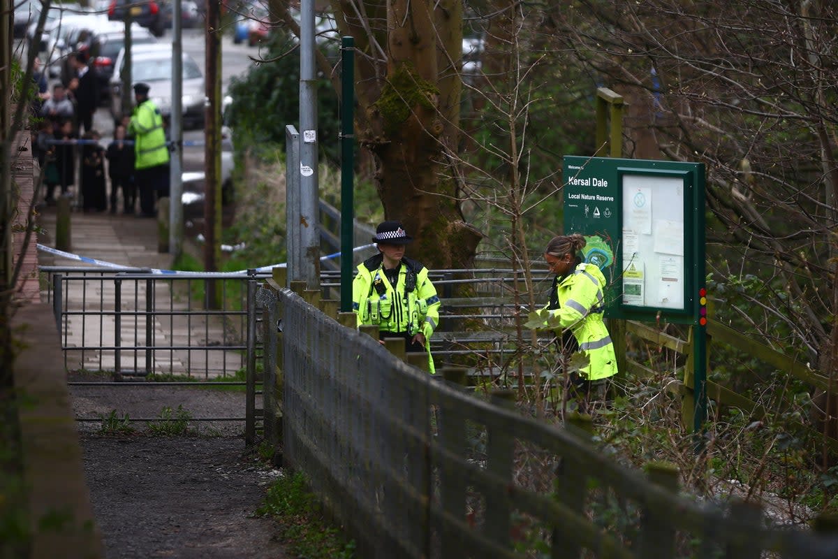 A heavy police presence guards the Kersal Dale woodlands where the remains were found on 5 April (Getty Images)