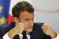 French President Emmanuel Macron delivers a speech at the Elysee Palace Thursday, April 25, 2019 in Paris. Macron makes a speech at the Elysee presidential palace based on three months of national debate aimed at addressing the protesters' concerns through town hall meetings and collecting complaints online. (AP Photo/Michel Euler)