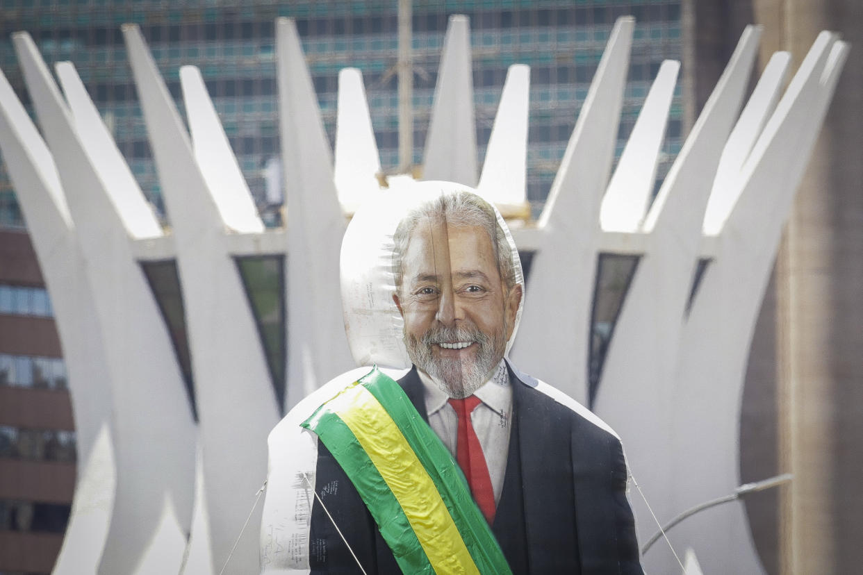 Supporters display an inflatable of Luiz Inacio Lula da Silva in front of the dome of the of the Cathedral in Brasilia, Brazil, prior to his inauguration as new president on Sunday, Jan. 1, 2023. (AP Photo/Gustavo Moreno)