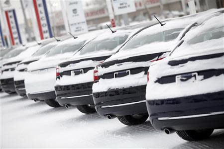 A row Chrysler 200s sit in the parking lot at Bill Snethkamp dealership in Detroit, Michigan January 2, 2014. REUTERS/Joshua Lott