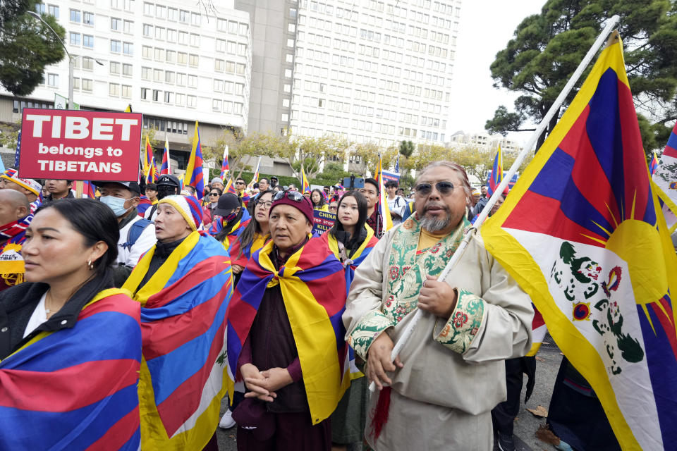 Demonstrators gather outside of the Chinese Consulate to protest the participation in the APEC Summit of Chinese President Xi Jinping Wednesday, Nov. 15, 2023, in San Francisco. (AP Photo/Tony Avelar)