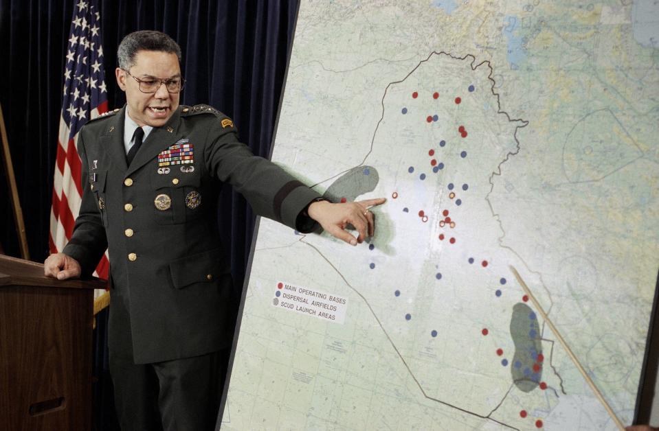 Chairman of the Joint Chiefs of Staff Colin Powell points to Iraqi airbases at a Pentagon briefing in 1991 in Washington.