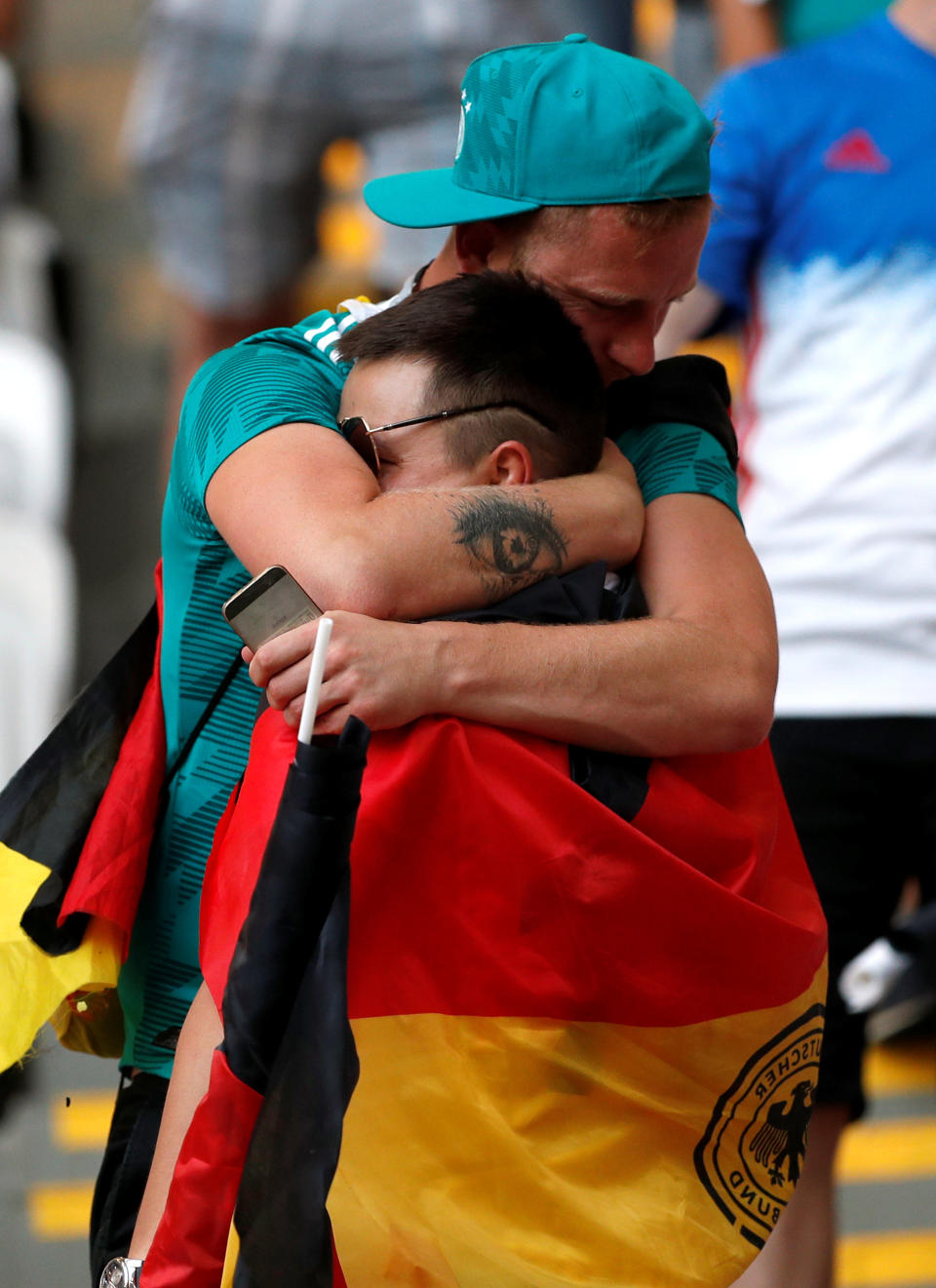 <p>Germany fans look dejected after the match as they go out of the World Cup. REUTERS/John Sibley </p>