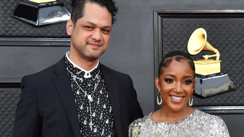 Mickey Guyton (R) and husband Grant Savoy arrive for the 64th Annual Grammy Awards at the MGM Grand Garden Arena in Las Vegas on April 3, 2022