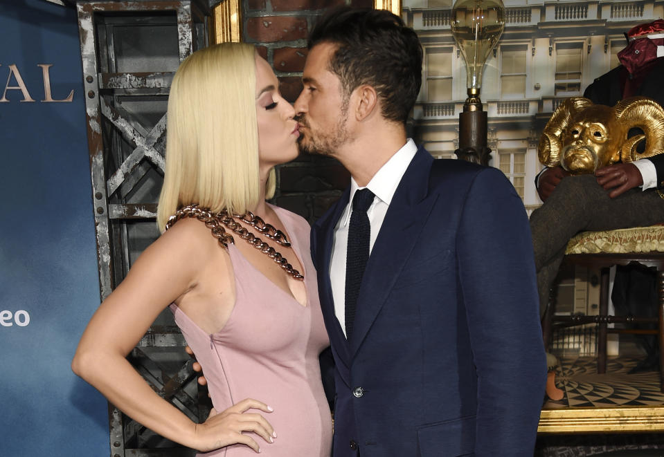 Orlando Bloom, right, a cast member in the Amazon Prime Video series "Carnival Row," shares a kiss with his girlfriend, singer Katy Perry, at the premiere of the series at the TCL Chinese Theatre, Wednesday, Aug. 21, 2019, in Los Angeles. (Photo by Chris Pizzello/Invision/AP)