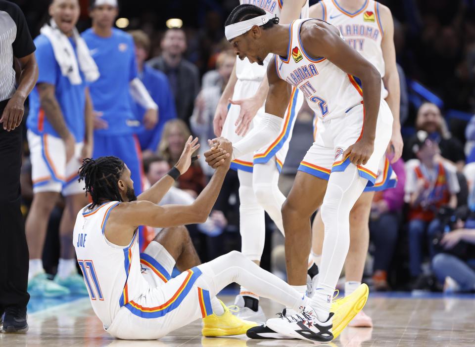 Nov 22, 2023; Oklahoma City, Oklahoma, USA; Oklahoma City Thunder guard Shai Gilgeous-Alexander (2) celebrates with guard <a class="link " href="https://sports.yahoo.com/nba/players/6441" data-i13n="sec:content-canvas;subsec:anchor_text;elm:context_link" data-ylk="slk:Isaiah Joe;sec:content-canvas;subsec:anchor_text;elm:context_link;itc:0">Isaiah Joe</a> (11) after scoring a three-point basket and gets the foul during the second half at Paycom Center. Mandatory Credit: Alonzo Adams-USA TODAY Sports