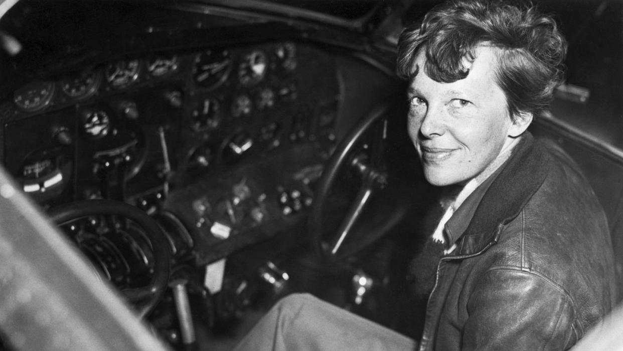 amelia earhart in the cockpit of an airplane