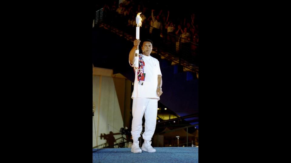 <p>19 Jul 1996: Muhammad Ali holds the torch before lighting the Olympic Flame during the Opening Ceremony of the 1996 Centennial Olympic Games in Atlanta, Georgia. (Mandatory Credit: Michael Cooper/Getty Images)</p>