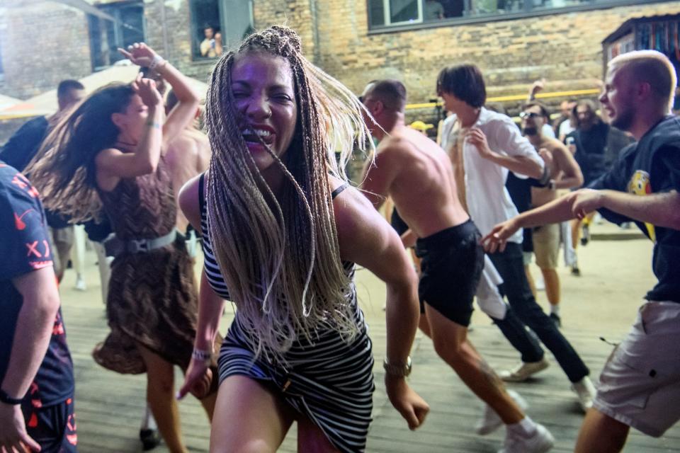 A woman dances at a rave party in central Kyiv, Ukraine, on August 27, 2022.