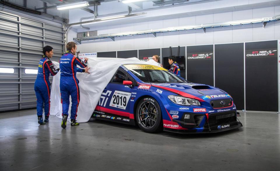 <p>Here the Subaru STI Nürburgring 24-hours race team pulls the sheet off of the coming year's race car. </p>