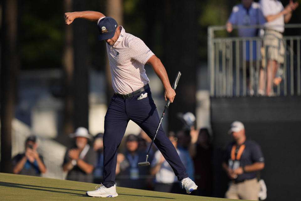 Bryson DeChambeau celebrates after a birdie on the 14th hole during the third round of the U.S. Open golf tournament Saturday, June 15, 2024, in Pinehurst, N.C. (AP Photo/Mike Stewart)