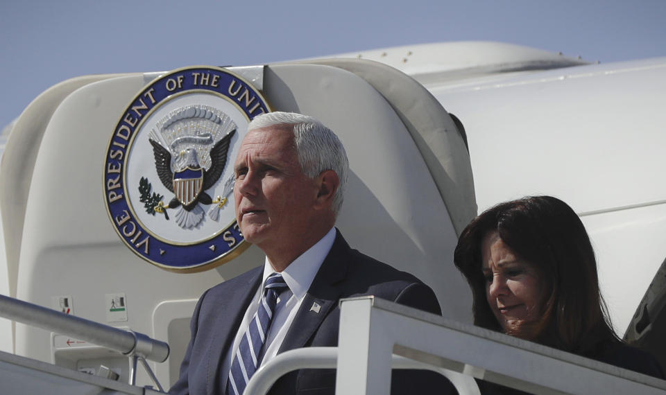 U.S. Vice President Mike Pence and his wife Karen exit the plane after landing in Warsaw, Poland, Sunday, Sept. 1, 2019. Pence will attend a memorial ceremony marking the 80th anniversary of the start of World War II. (AP Photo/Petr David Josek)