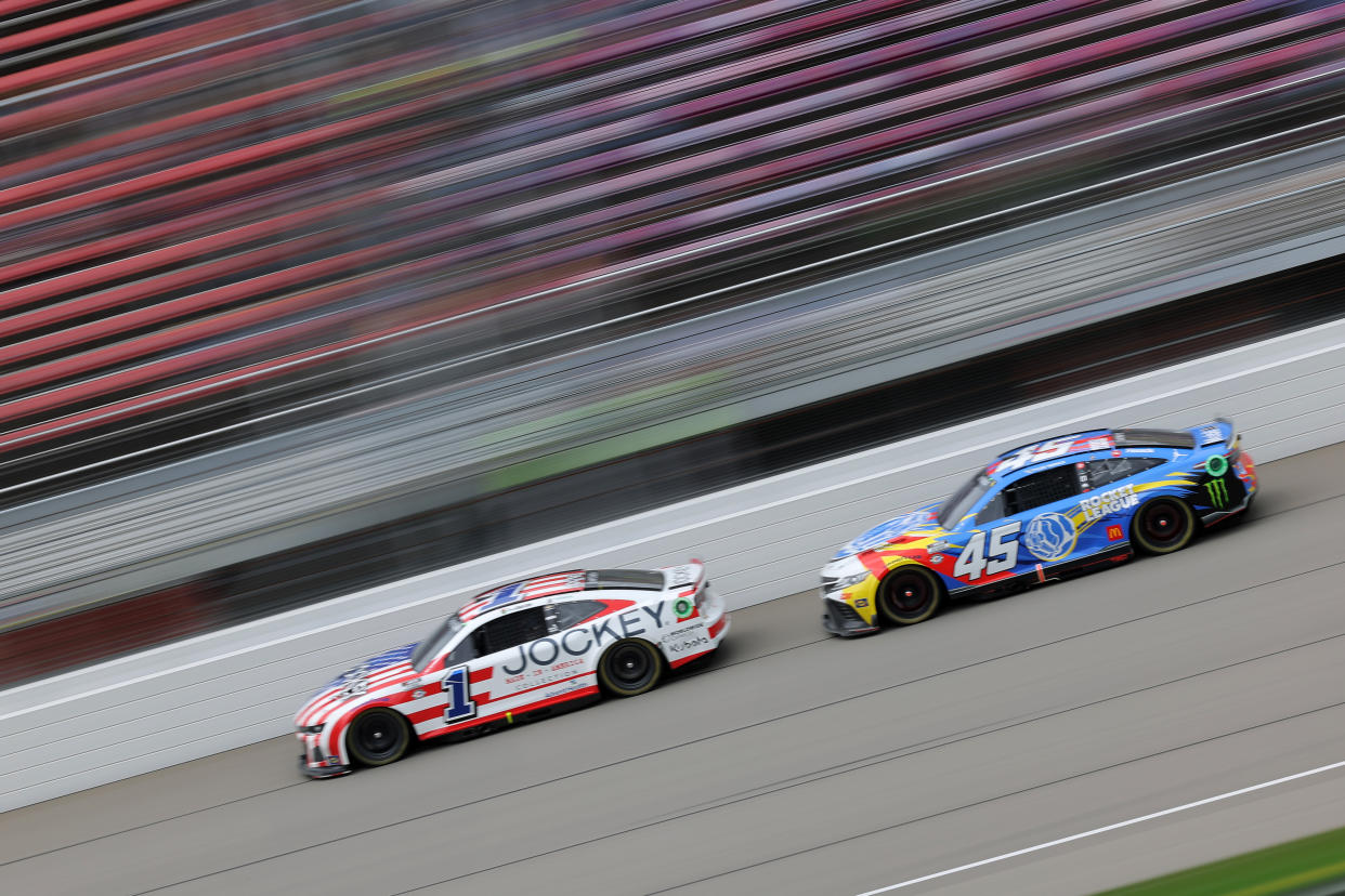 BROOKLYN, MICHIGAN - AUGUST 07: Ross Chastain, driver of the #1 Jockey Chevrolet, and Tyler Reddick, driver of the #45 Rocket League Toyota, race during the NASCAR Cup Series FireKeepers Casino 400 at Michigan International Speedway on August 07, 2023 in Brooklyn, Michigan. (Photo by Jonathan Bachman/Getty Images)