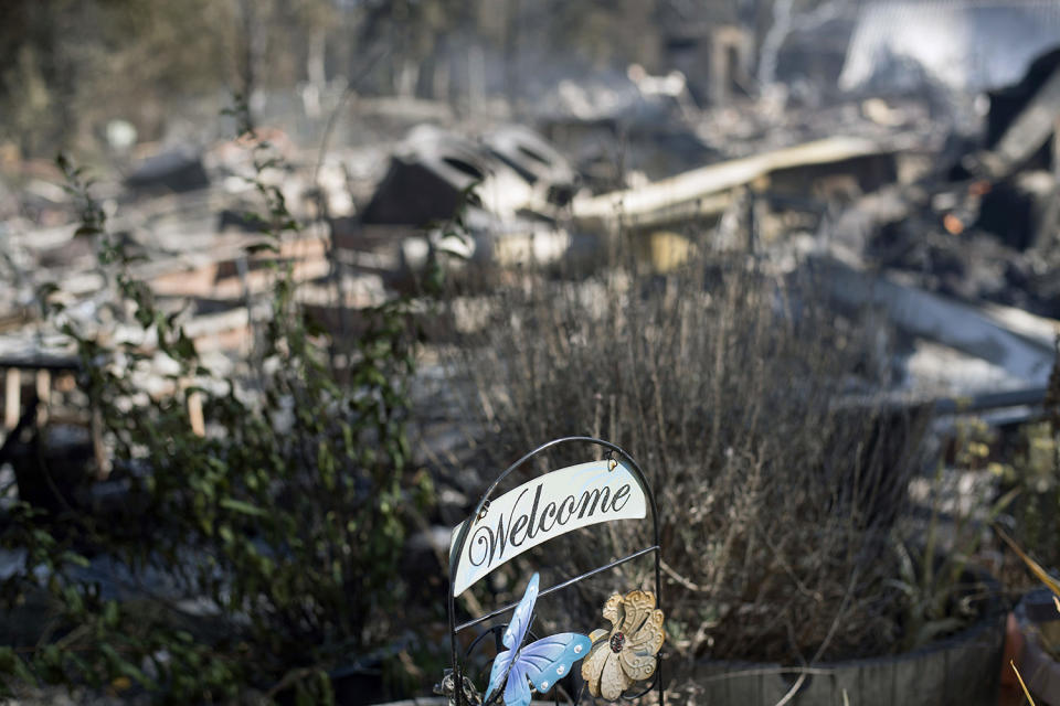 <p>A welcome sign rests in front of residence leveled by a wildfire Sunday, July 9, 2017, near Oroville, Calif. Wildfires barreled across the baking landscape of the western U.S. and Canada, destroying a smattering of homes and forcing thousands to flee. (AP Photo/Noah Berger) </p>