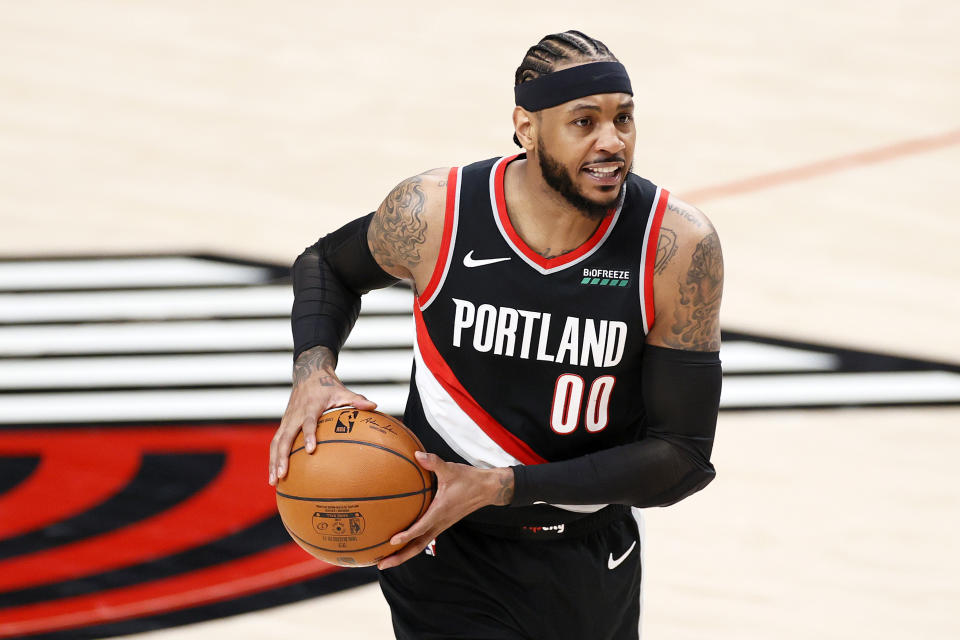 Carmelo Anthony #00 of the Portland Trail Blazers looks to pass in the first quarter against the Denver Nuggets during Round 1, Game 4 of the 2021 NBA Playoffs at Moda Center on May 29, 2021 in Portland, Oregon. NOTE TO USER: User expressly acknowledges and agrees that, by downloading and or using this photograph, User is consenting to the terms and conditions of the Getty Images License Agreement. (Photo by Steph Chambers/Getty Images)