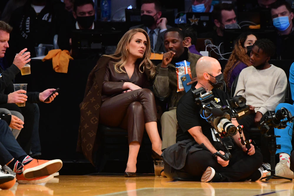 Adele wows in double denim and heels for date night at NBA game