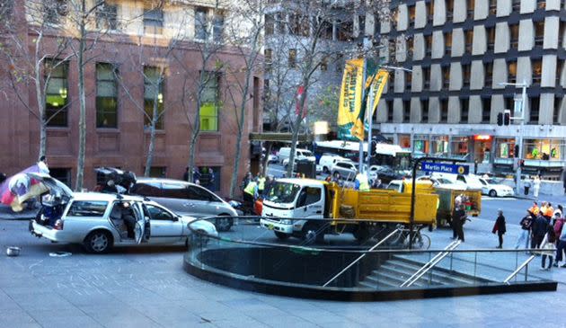 Police and city council workers move in to dismantle the Occupy Sydney camp. Photo: 7News