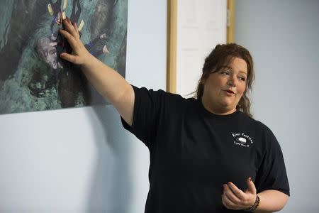 River Ventures tour operations manager Brandi Bruton gives the required orientation to guests before heading out to snorkel with the manatees at the Three Sisters Springs in Crystal River, Florida January 15, 2015. REUTERS/Scott Audette