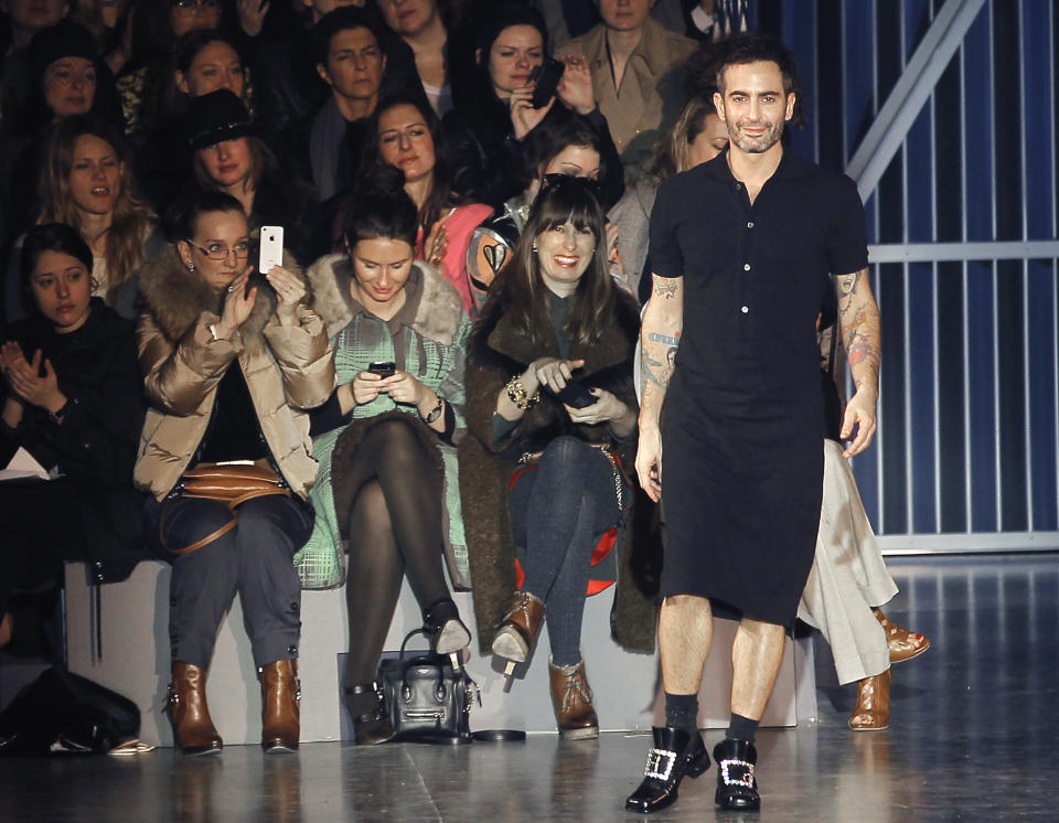 U.S fashion designer Marc Jacobs receives applause after his presentation for the Louis Vuitton collection, Women's Fall-Winter, ready-to-wear 2013 during Paris Fashion week, Wednesday, March 7, 2012. (AP Photo/Jacques Brinon)