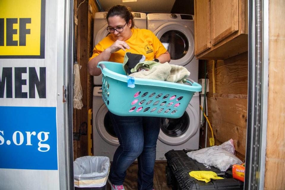 Susan Pearson with a N.C. Baptists on Mission disaster relief crew washes laundry for people effected by power outages in Moore County Tuesday, Dec. 6, 2022 at the First Baptist Church of Pinehurst . Two deliberate attacks on electrical substations in Moore County Saturday evening caused days-long power outages for tens of thousands of customers.