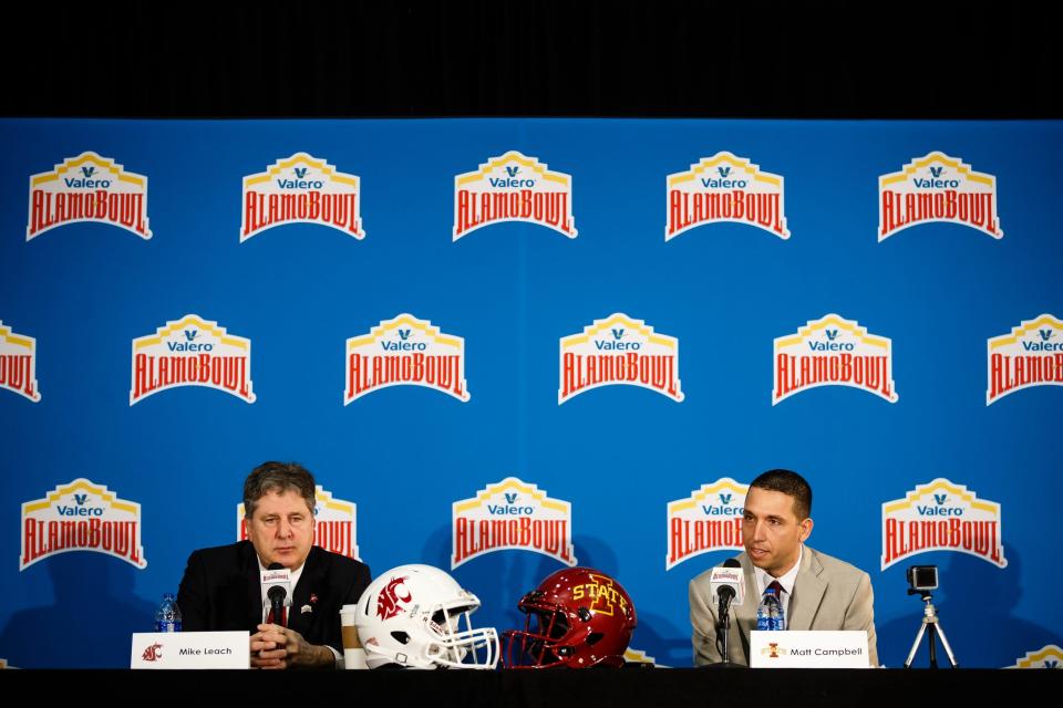 Iowa State coach Matt Campbell (right) and Washington State's Mike Leach sit together at the 2018 Alamo Bowl.