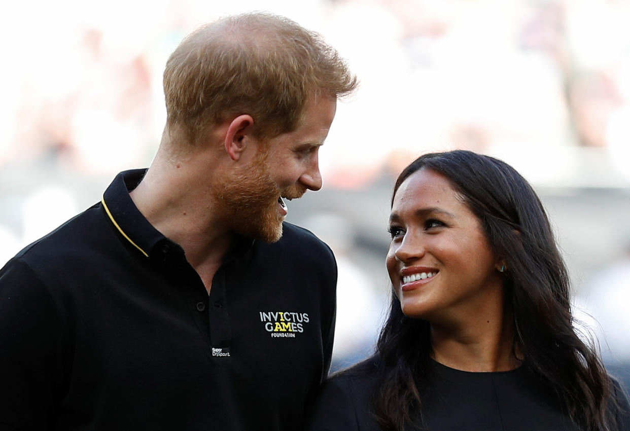 Britain's Prince Harry, Duke of Sussex and Britain's Meghan, Duchess of Sussex arrive on the field prior to the start of the first of a two-game series between  the New York Yankees and the Boston Red Sox at London Stadium in Queen Elizabeth Olympic Park, east London on June 29, 2019. - As Major League Baseball prepares to make history in London, New York Yankees manager Aaron Boone and Boston Red Sox coach Alex Cora are united in their desire to make the ground-breaking trip memorable on and off the field. (Photo by PETER NICHOLLS / POOL / AFP)        (Photo credit should read PETER NICHOLLS/AFP/Getty Images)