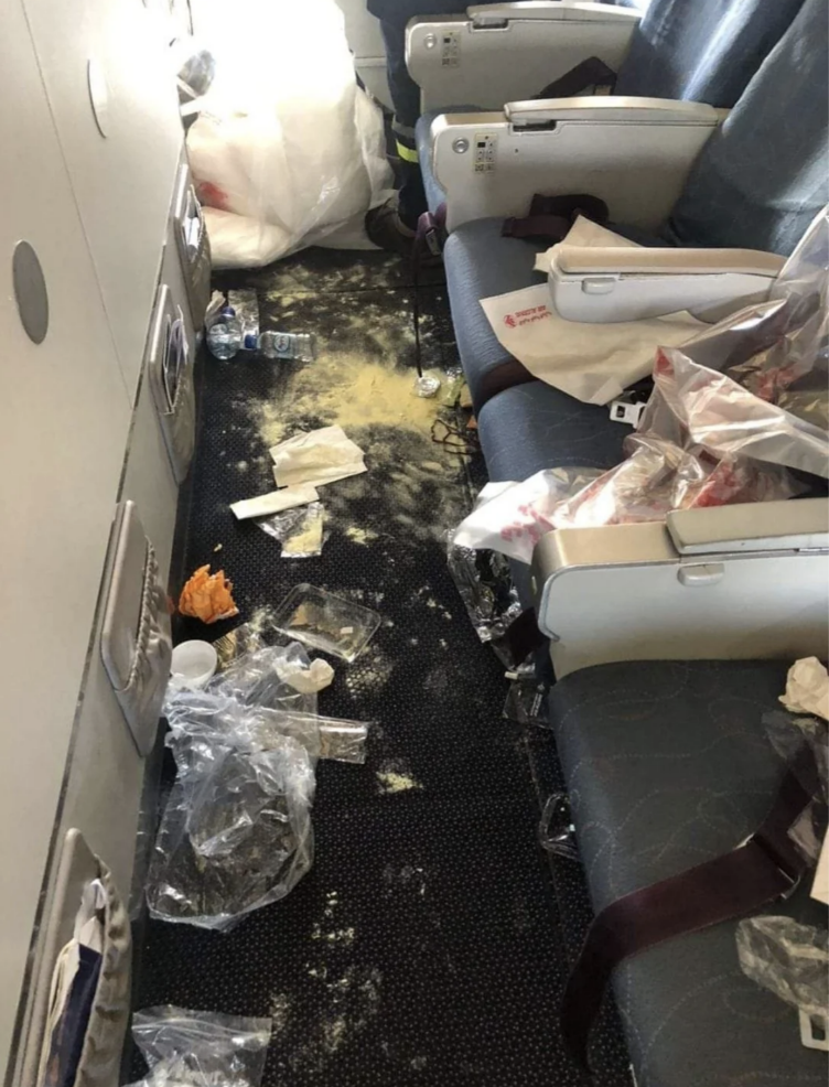 A completely trashed row of an airplane