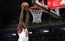New York Knicks forward Julius Randle (30) goes to the basket for a dunk against the Cleveland Cavaliers during the second half of an NBA basketball game in New York, Sunday, Nov. 7, 2021. (AP Photo/Noah K. Murray)