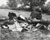 Battle of Britain: British soldier examining the wreckage of a downed German plane.