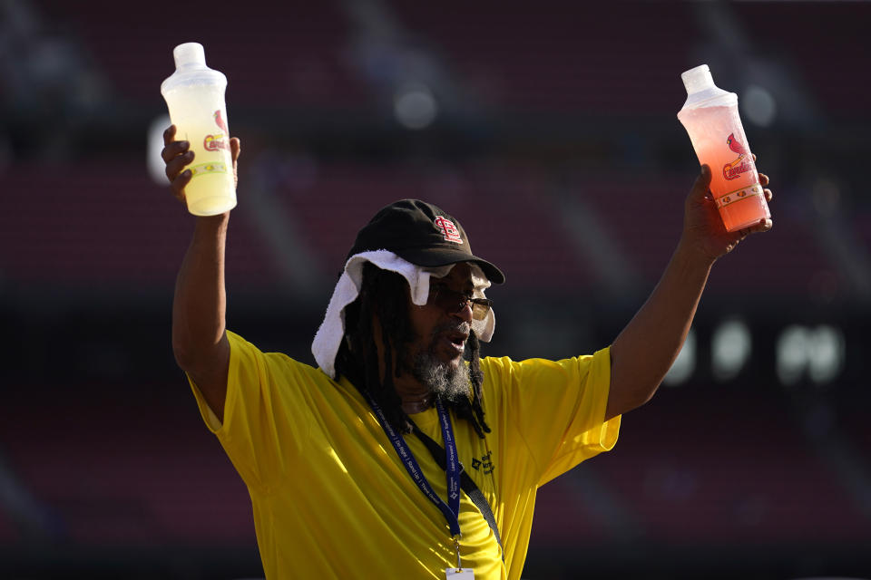 FILE - A vendor sells cold drinks before the start of a baseball game between the St. Louis Cardinals and the Chicago Cubs, July 28, 2023, in St. Louis. European climate monitoring organization made it official: July 2023 was Earth's hottest month on record by a wide margin. (AP Photo/Jeff Roberson, File)