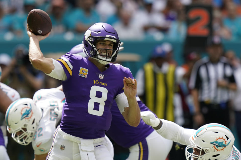 Minnesota Vikings quarterback Kirk Cousins (8) passes during the first half of an NFL football game against the Miami Dolphins, Sunday, Oct. 16, 2022, in Miami Gardens, Fla. (AP Photo/Lynne Sladky)
