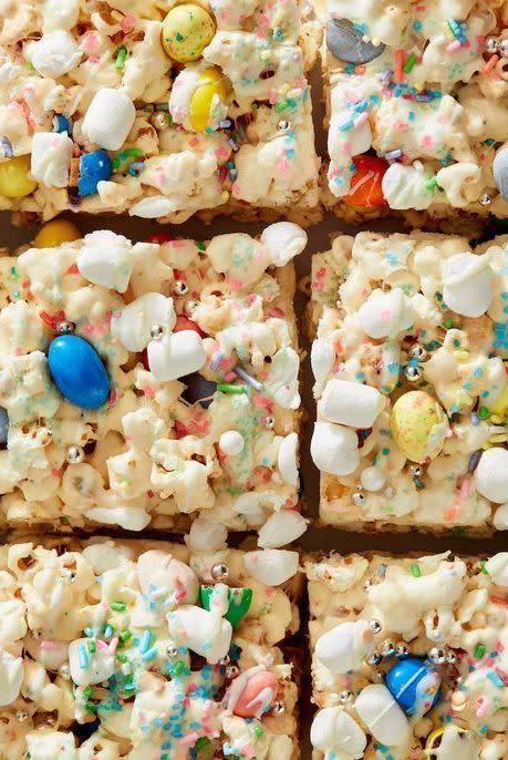 <p>These sticky, sweet popcorn bars are studded with all your favorite Easter candies. </p><p>Get the <strong><a href="https://www.delish.com/holiday-recipes/easter/a39466083/easter-bunny-popcorn-bars-recipe/" rel="nofollow noopener" target="_blank" data-ylk="slk:Easter Bunny Popcorn Bars recipe;elm:context_link;itc:0;sec:content-canvas" class="link ">Easter Bunny Popcorn Bars recipe</a> </strong>from Delish.</p>