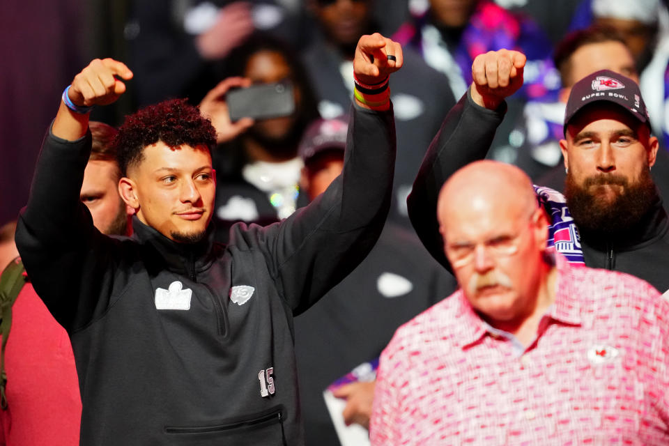 LAS VEGAS, NEVADA - FEBRUARY 05: (L-R) Patrick Mahomes, head coach Andy Reid, and Travis Kelce of the Kansas City Chiefs walk across the field during Super Bowl LVIII Opening Night at Allegiant Stadium on February 05, 2024 in Las Vegas, Nevada. (Photo by Chris Unger/Getty Images)