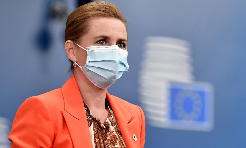 Denmark's Prime Minister Mette Frederiksen wears a protective face mask as she arrives for an EU summit at the European Council building in Brussels, Friday, July 17, 2020. Leaders from 27 European Union nations meet face-to-face on Friday for the first time since February, despite the dangers of the coronavirus pandemic, to assess an overall budget and recovery package spread over seven years estimated at some 1.75 trillion to 1.85 trillion euros. (John Thys, Pool Photo via AP)