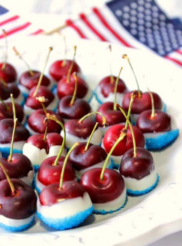 <p>Kudos Kitchen by Renee</p><p>With only three ingredients and about ten minutes of your time, dressed-up cherries will be a huge hit.</p><p><strong>Get the recipe: <a href="https://www.kudoskitchenbyrenee.com/red-white-blue-sugared-cherries/" rel="nofollow noopener" target="_blank" data-ylk="slk:Speedy Patriotic Red White & Blue Sugared Cherries;elm:context_link;itc:0;sec:content-canvas" class="link ">Speedy Patriotic Red White & Blue Sugared Cherries</a></strong></p>
