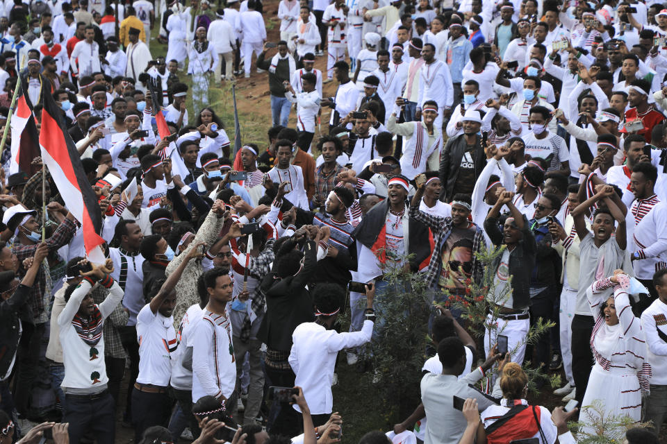 Oromos protest against the government and call for the release of prominent opposition figure Jawar Mohammed and others, during the annual Irreecha festival in the capital Addis Ababa, Ethiopia Saturday, Oct. 2, 2021. Ethiopia's largest ethnic group, the Oromo, on Saturday celebrated the annual Thanksgiving festival of Irreecha, marking the end of winter where people thank God for the blessings of the past year and wish prosperity for the coming year. (AP Photo)