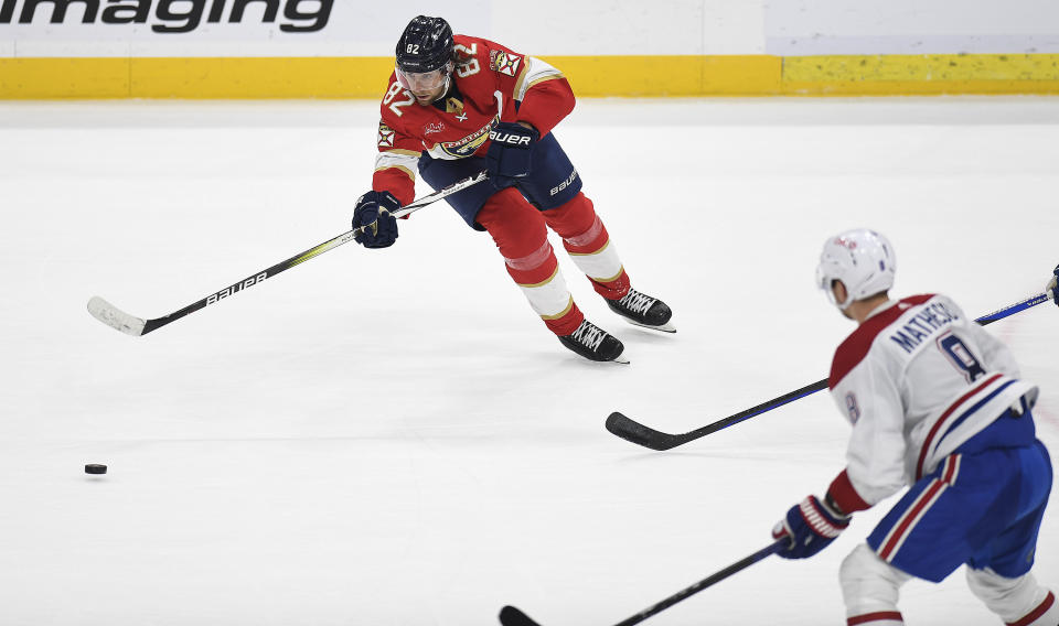 Florida Panthers center Kevin Stenlund (82) skates toward Montreal Canadiens defenseman Mike Matheson during the second period of an NHL hockey game Saturday, Dec. 30, 2023, in Sunrise, Fla. (AP Photo/Michael Laughlin)