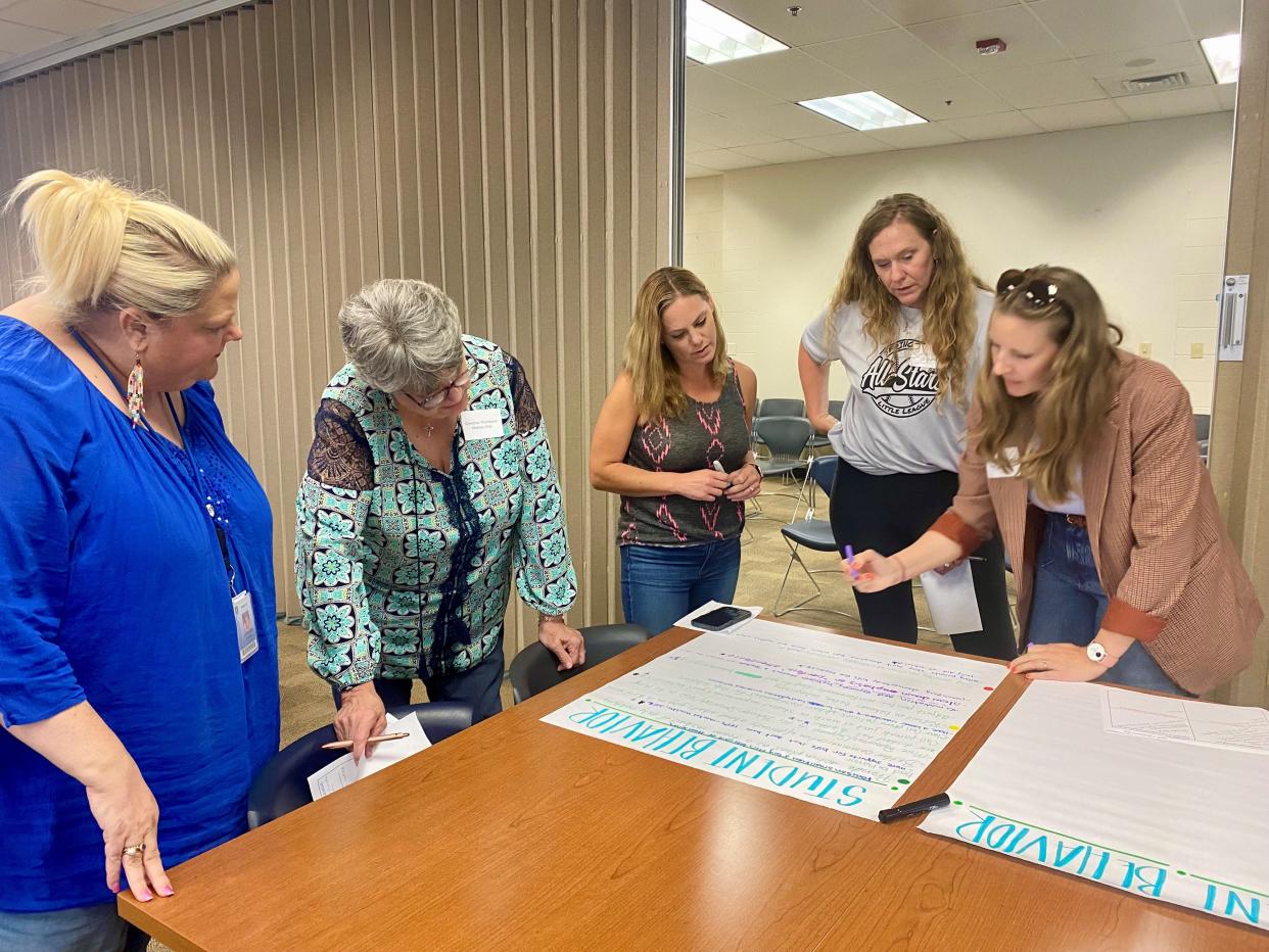 Springfield parents attend the Superintendent Solutions event Monday evening. From right: Sarah Jean Baker, Susan Curtis, Stephanie Sproule, Christine Thompson. Jennifer Webb, the coordinator of student and school services, was available for questions.