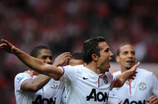 Manchester United's Robin van Persie (C) celebrates scoring his third goal against Southampton during their Premier League football match at St Mary's in Southampton