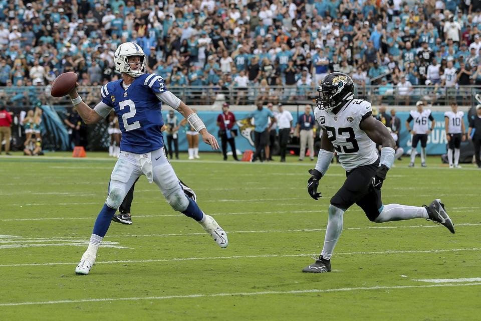 Indianapolis Colts quarterback Matt Ryan (2) attempts a pass in front of Jacksonville Jaguars linebacker Foyesade Oluokun (23) during a NFL football game, Sunday, September 18, 2022 in Jacksonville, Fla. (AP Photo/Alex Menendez)