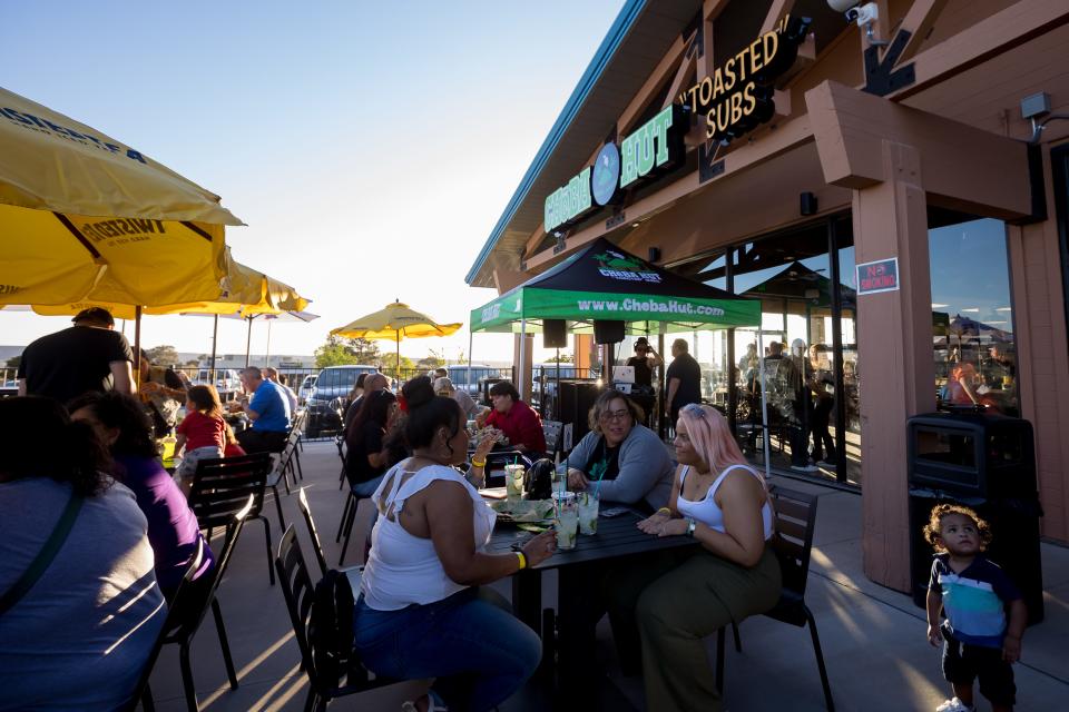 Customers enjoy their sandwiches at Cheba Hut "Toasted" Subs on their VIP party on Wednesday, April 17, 2024. The second location set to open on April 19 is at 730 Sunland Park Dr, in West El Paso, TX.