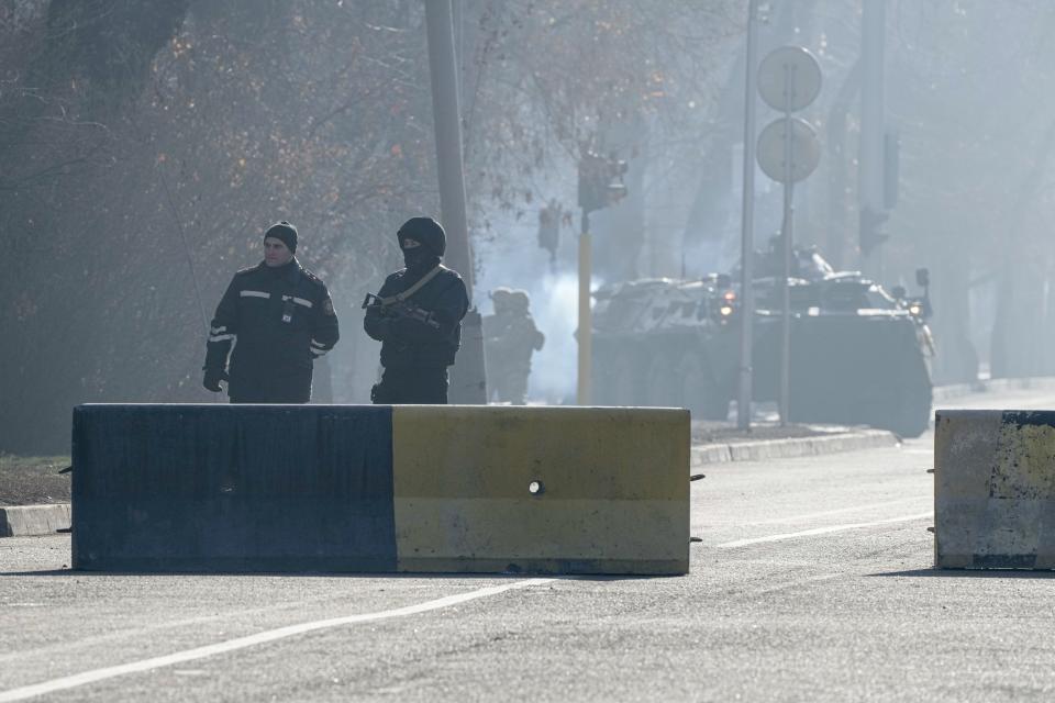 Police block the road to control the traffic in Almaty, Kazakhstan, Wednesday, Jan. 12, 2022. Kazakh authorities said Wednesday they detained 1,678 more people in the past 24 hours over their alleged participation in the violent unrest that rocked the former Soviet nation last week, the worst since Kazakhstan gained independence three decades ago. (AP Photo)