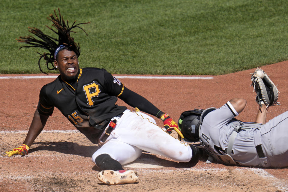 Pittsburgh Pirates' Oneil Cruz (15) is injured as he is tagged out attempting to score by Chicago White Sox catcher Seby Zavala during the sixth inning of a baseball game in Pittsburgh, Sunday, April 9, 2023. A bench clearing brawl ensued as a result of the play. The Pirates won 1-0. (AP Photo/Gene J. Puskar)