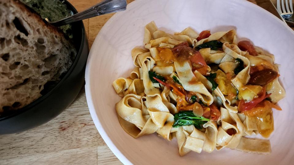 Wolfpeach's tagliatelle with tomatoes and basil and sourdough bread.