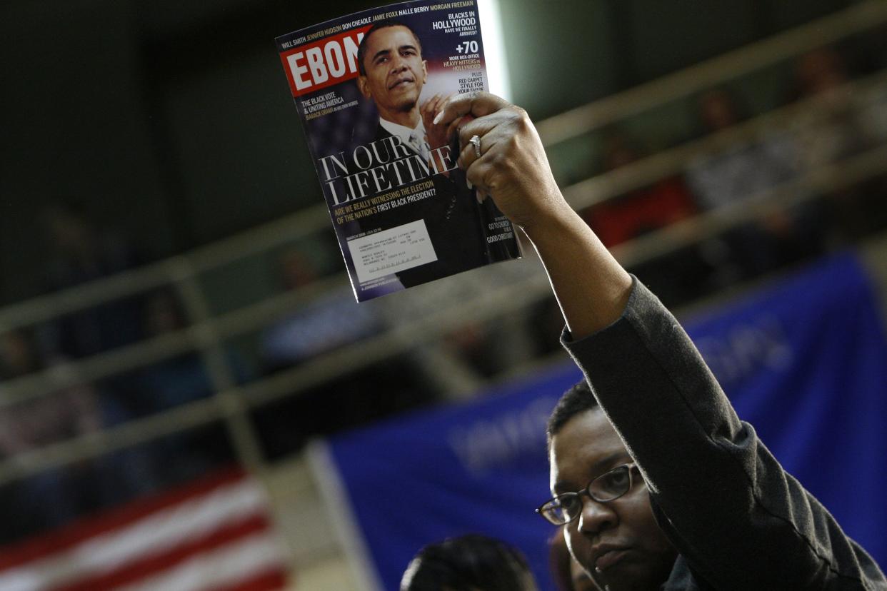 A woman holds a copy of Ebony magazine, featuring a cover picture of U.S. presidential hopeful , Sen. Barack Obama (D-IL) at a campaign stop at the Waukesha County Exposition February 13, 2008 in Waukesha, Wisconsin.