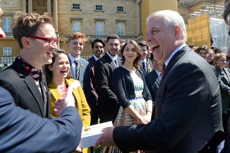 FILE PHOTO: Britain's Prince Andrew talks to Tom Fletcher at a ceremony for Gold Award recipients of the Duke of Edinburgh's Award at Buckingham Palace Gardens in London