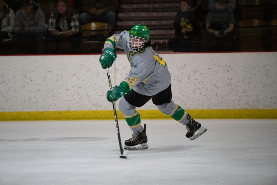 Pueblo County's Zeke Phillips clears the puck during a game against Woodland Park on Saturday, Dec. 10, 2022