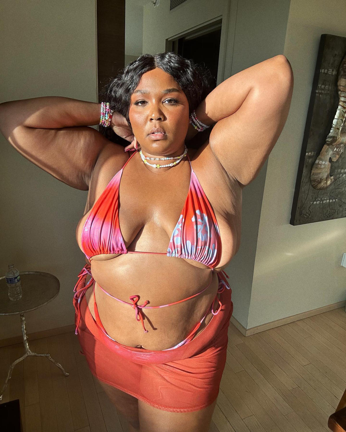 Lizzo Is Ready for Bikini Season, Poses in Pink Swimsuit Over Memorial Day Weekend Photo