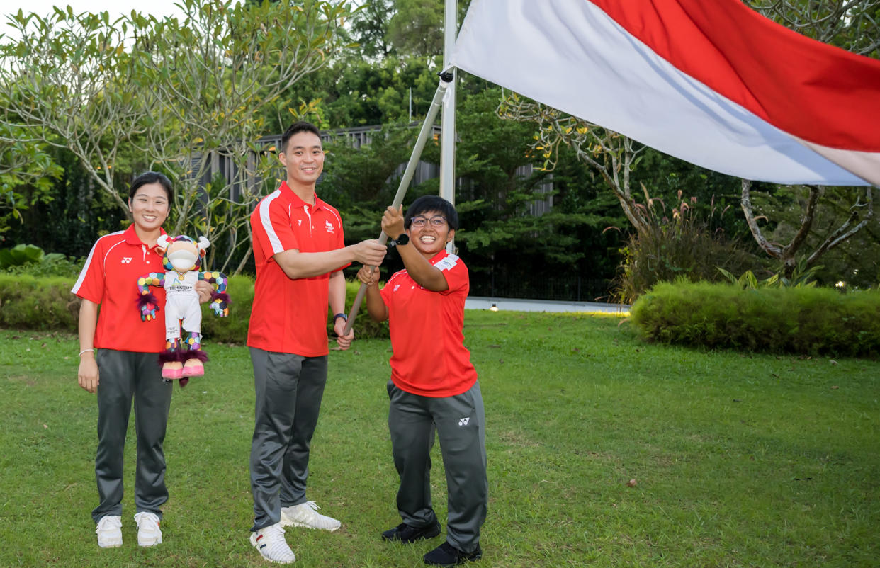 The Singapore contingent for the 2022 Commonwealth Games is led by (from left) chef de mission Lim Heem Wei, and flag bearers Terry Hee and Nur'Aini Mohamad Yasli. (PHOTO: Andy Chua/SNOC)