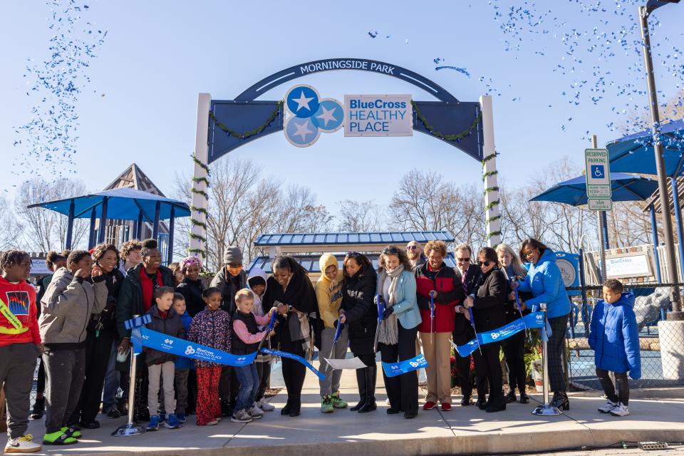 Representatives from the city of Knoxville and the BlueCross BlueShield of Tennessee Foundation celebrate the grand opening of the BlueCross Healthy Place at Morningside Park on Dec. 14, 2023. The $5.5 million investment from the BlueCross Foundation brought new playgrounds, trails and a community pavilion to Morningside Park, which will be a key part of the Reconnecting Knoxville project.